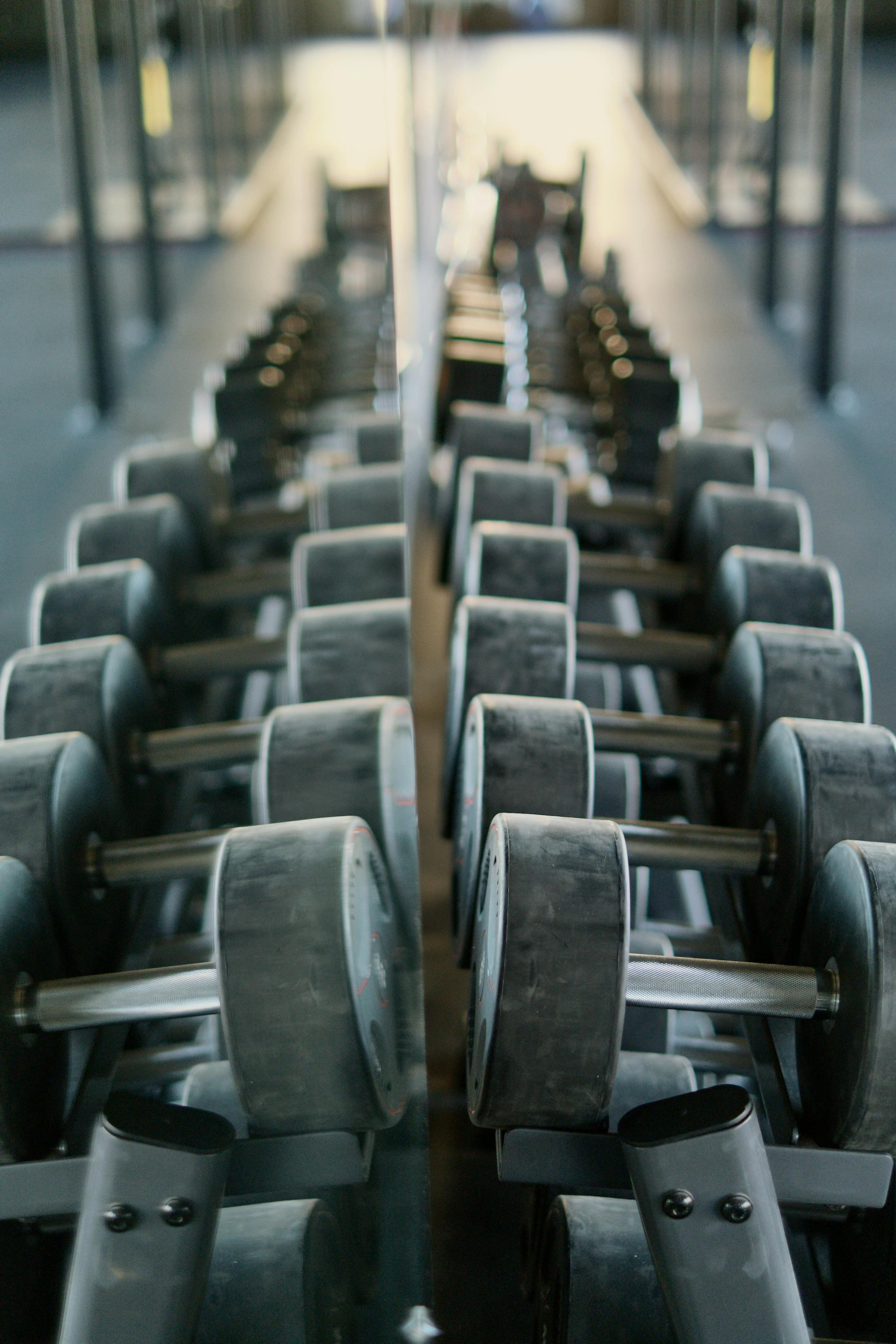 Dumbbell rack and weights on the floor at Ridgepole Fitness